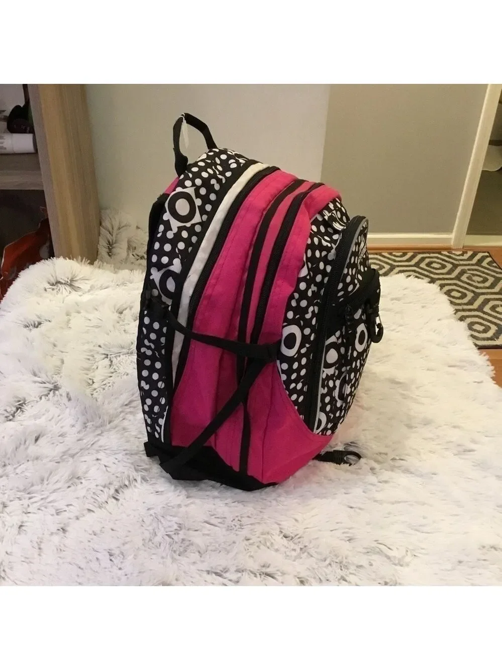 High Sierra pink black and White patterned backpack with suspension stra…